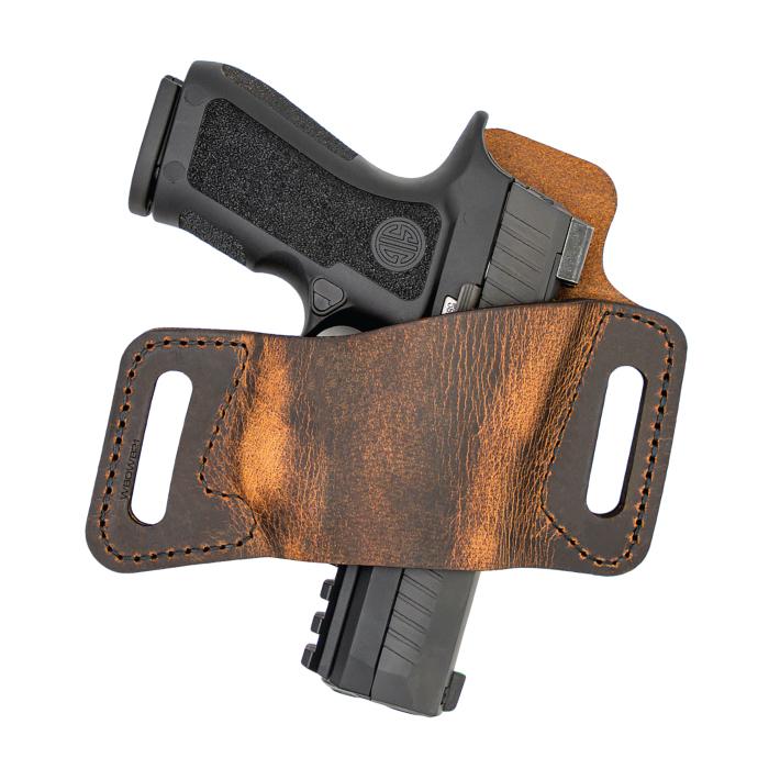 Handgun in brown leather holster
