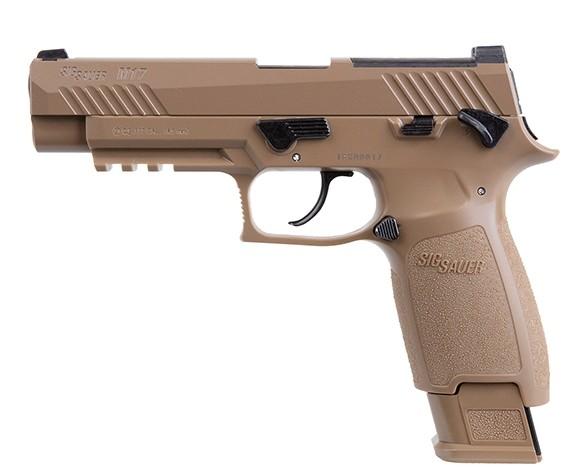 Tan handgun on a white background.