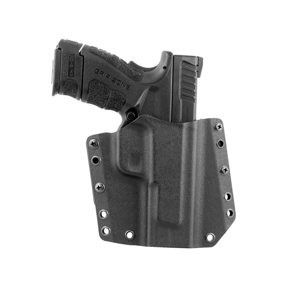 Black handgun in a secure holster.