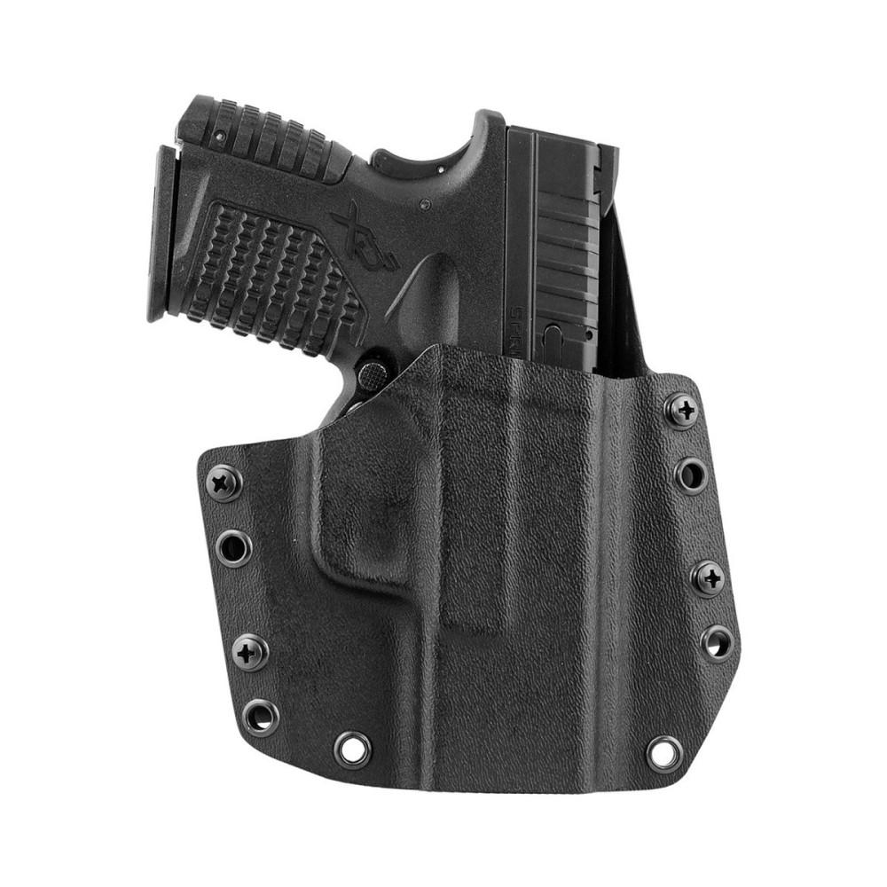 Handgun in a black holster for secure storage.