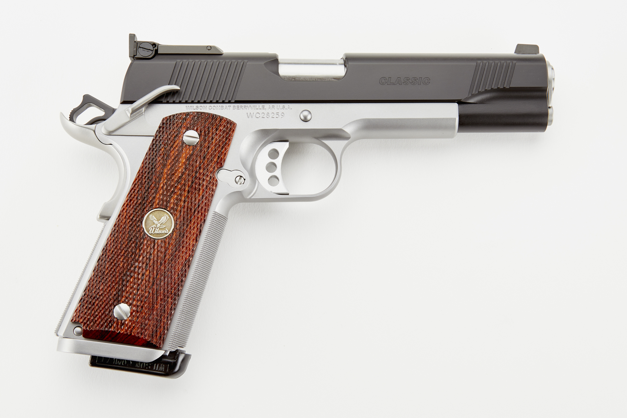 Stainless steel pistol with wooden grip.