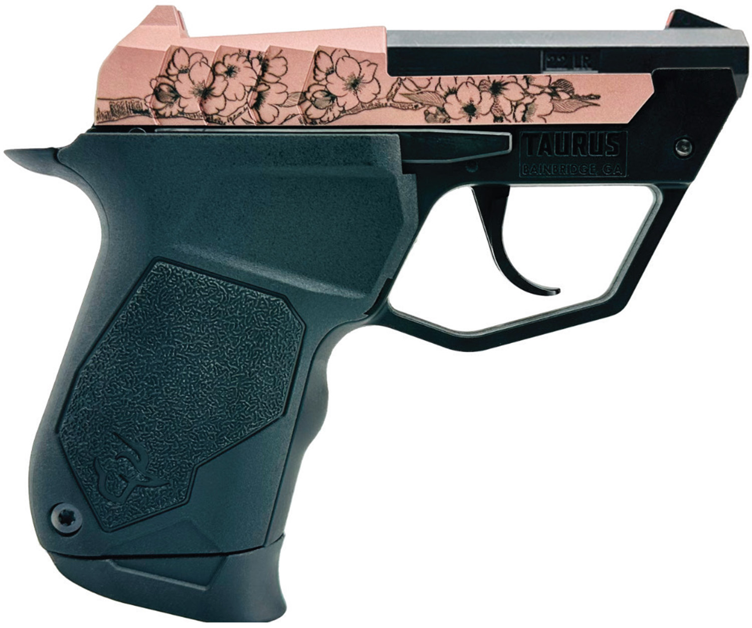 Compact firearm with decorative floral design.