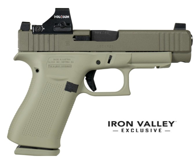 Olive green handgun with optic sight.