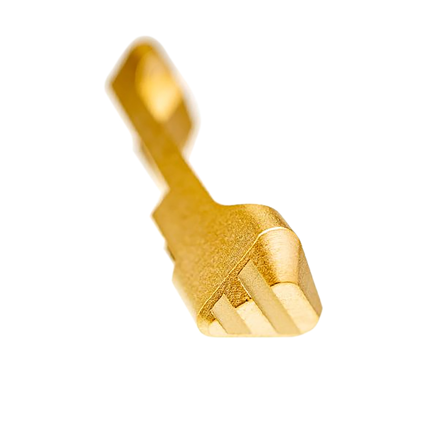 Close-up of a gold key on white background.