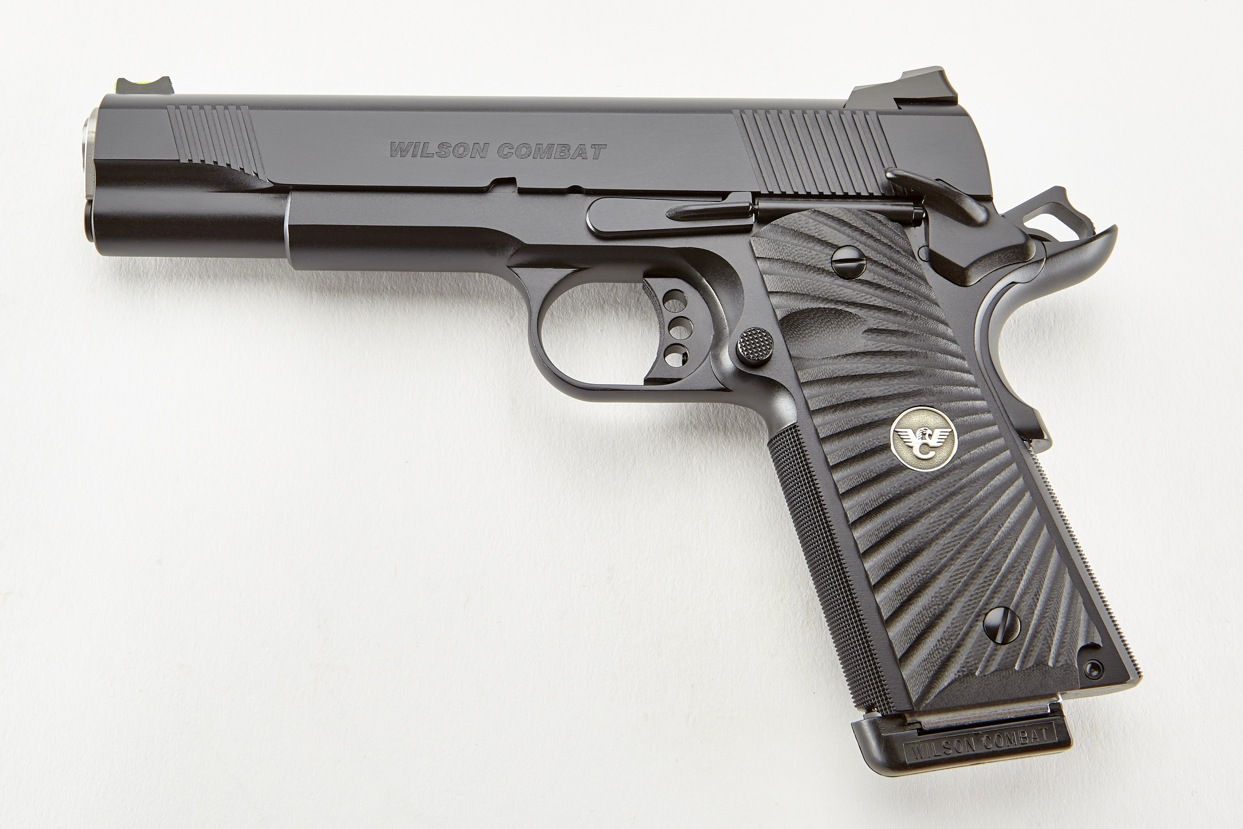 Black Wilson Combat pistol on a white surface