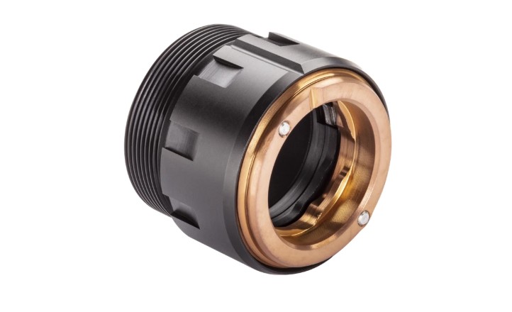 Close-up of a black and gold camera lens mount