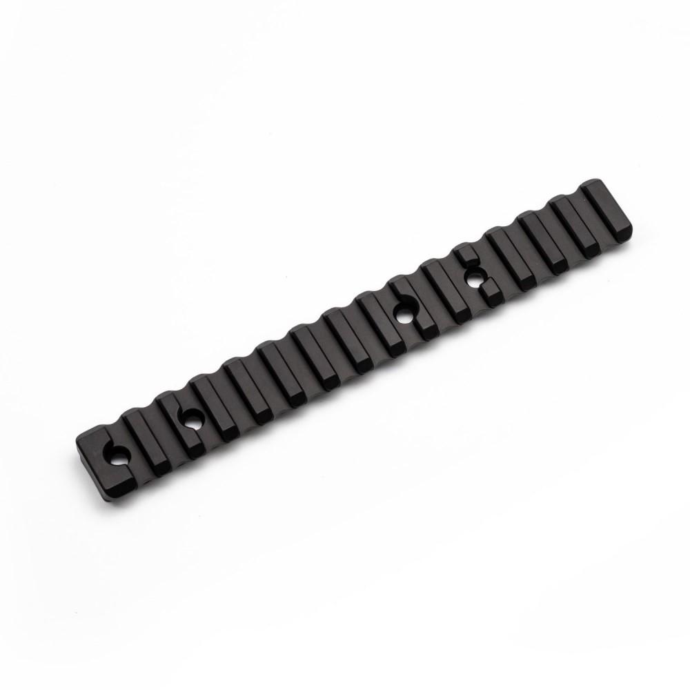 Black accessory with grooves and mounting holes