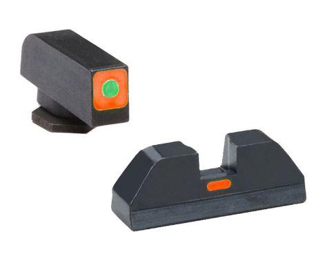 Two handgun sights with bright colored dots.
