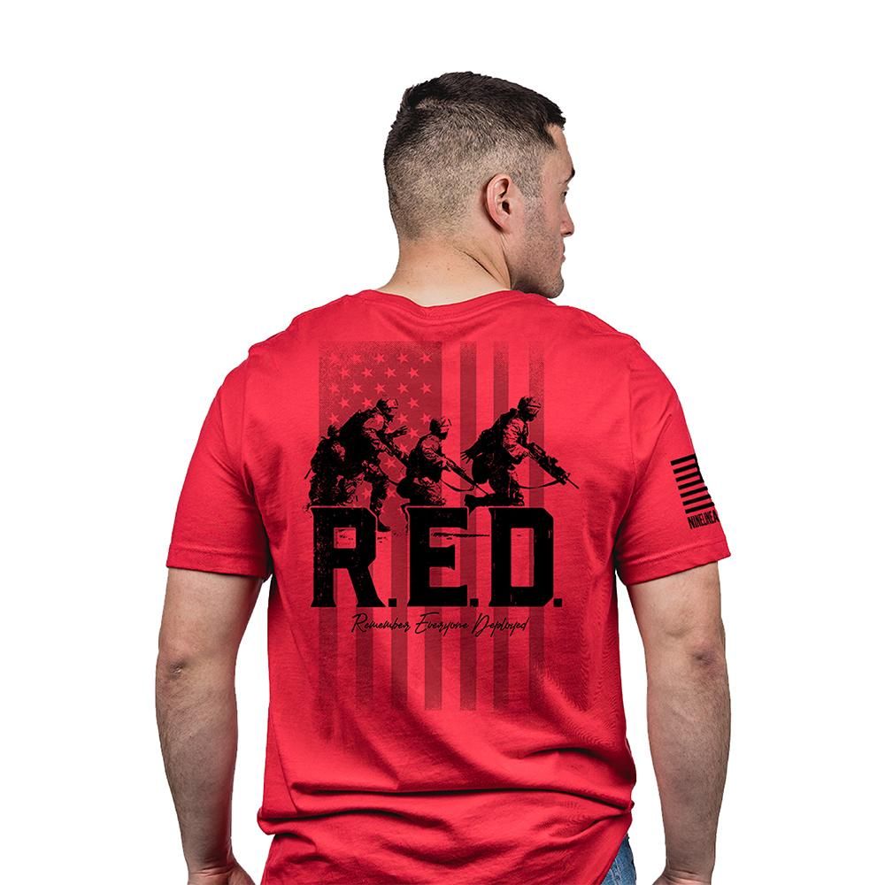 Red t-shirt with military graphic and flag design.