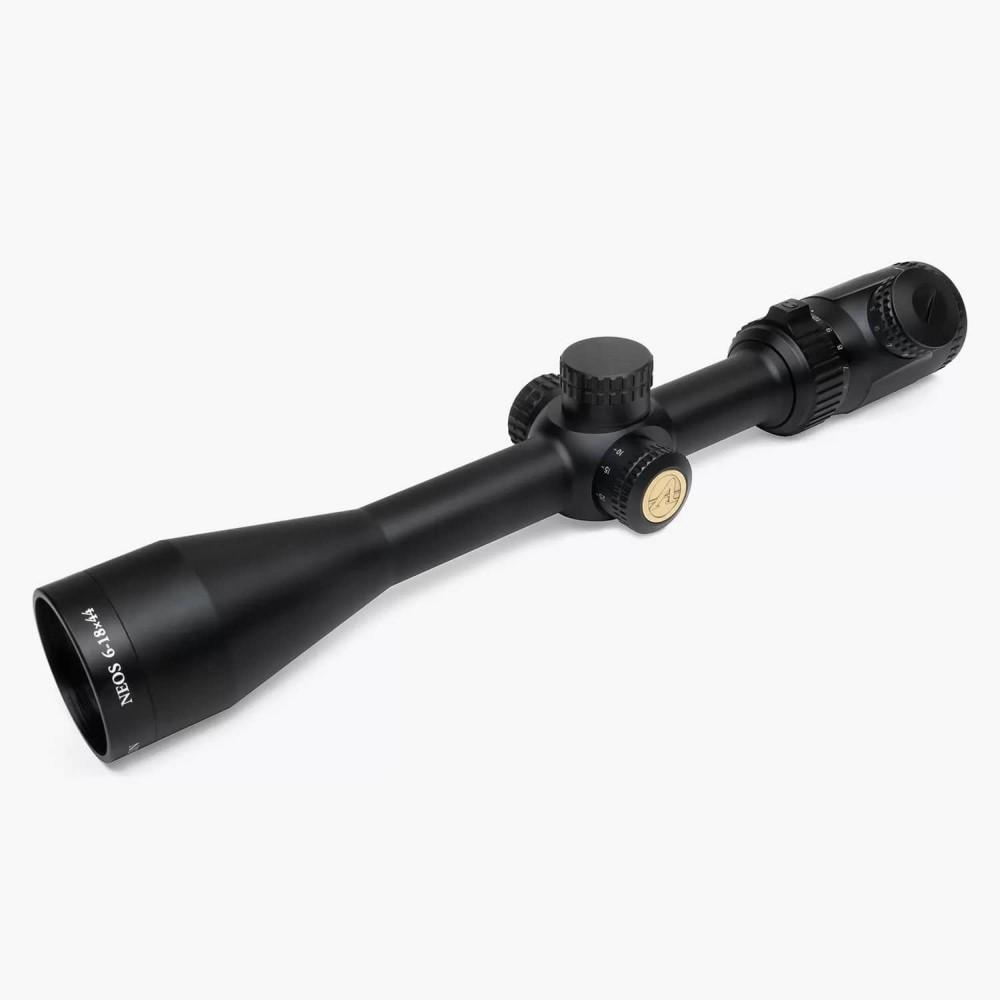 Black rifle scope with adjustable magnification settings.