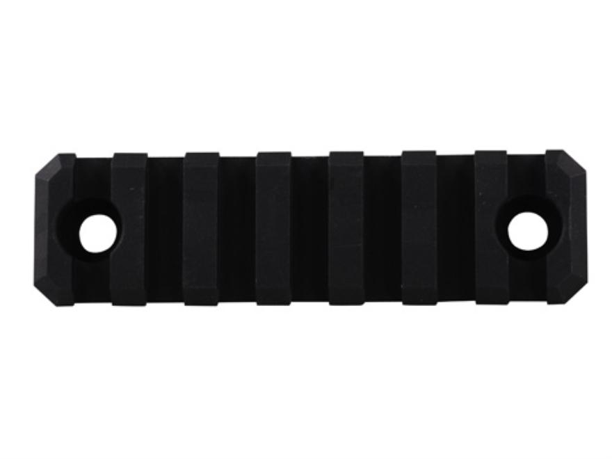 Black tactical rail accessory with multiple slots
