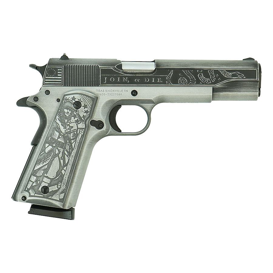 Engraved pistol with detailed artwork design.