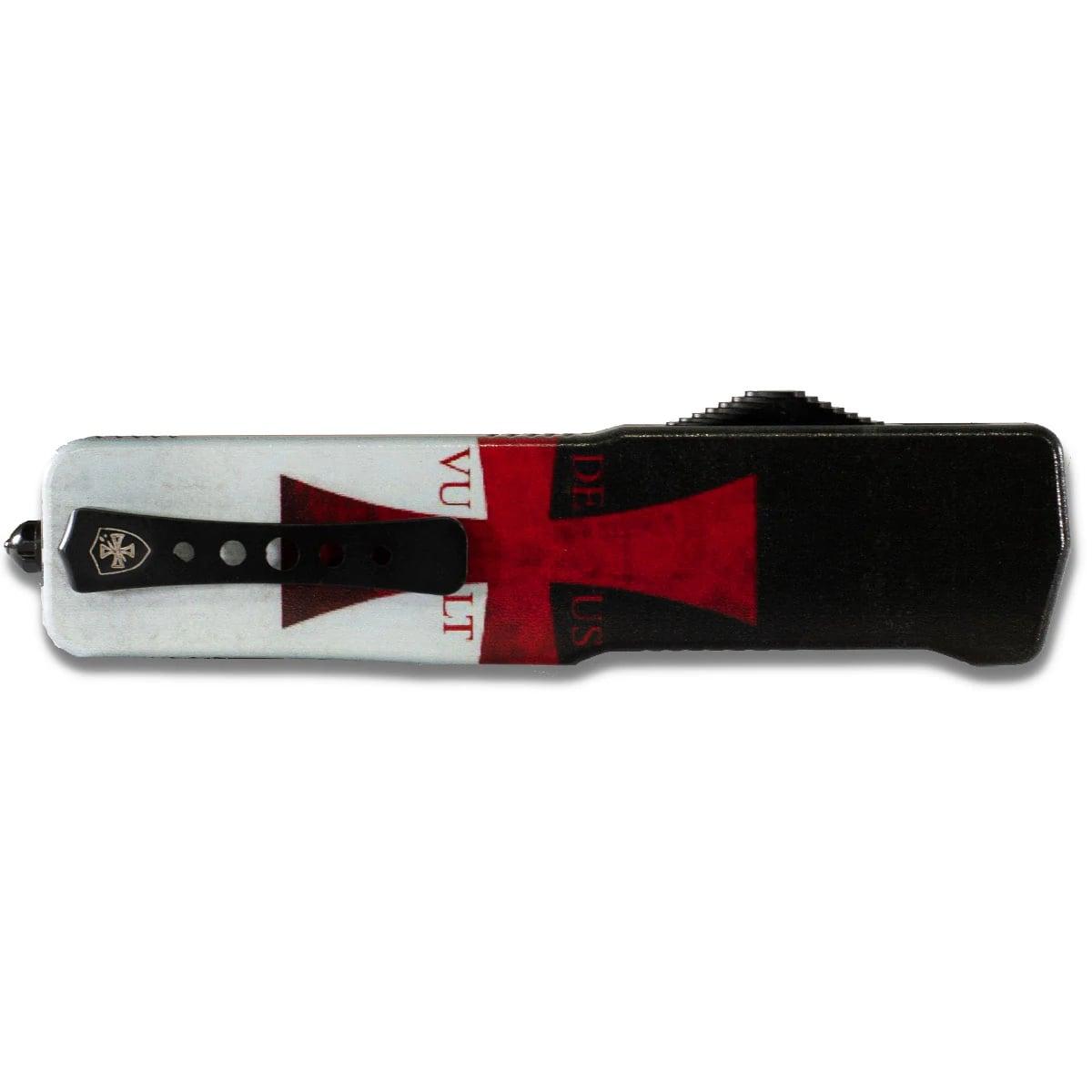 Knife with red cross design on handle.