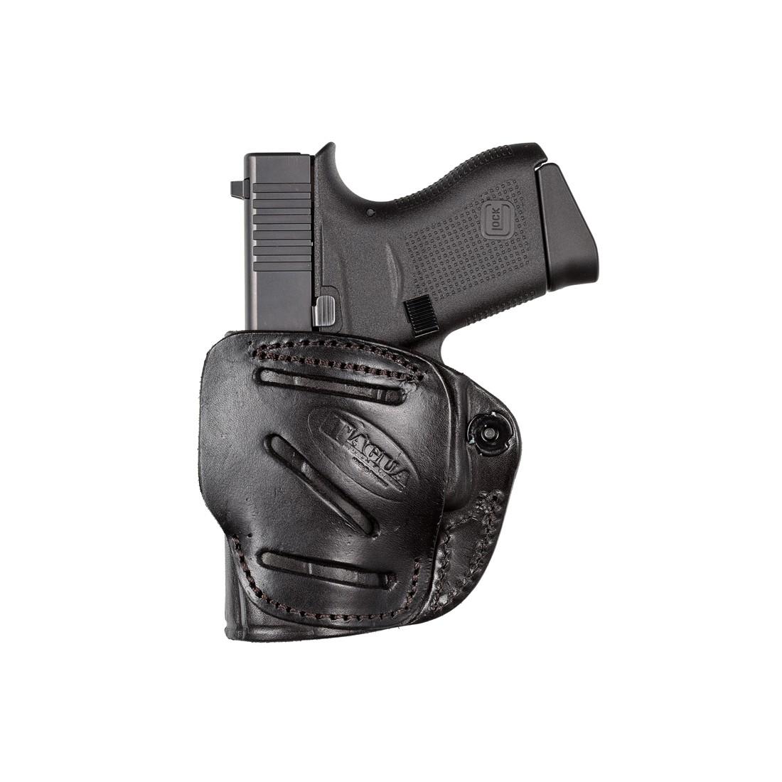 Black handgun in leather holster.