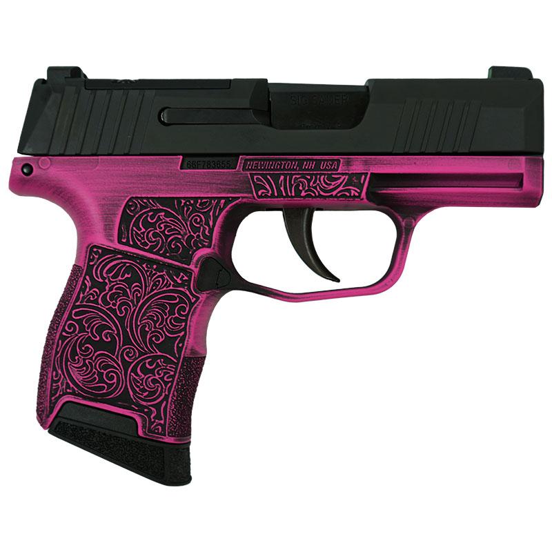 Pink decorative handgun with intricate design.