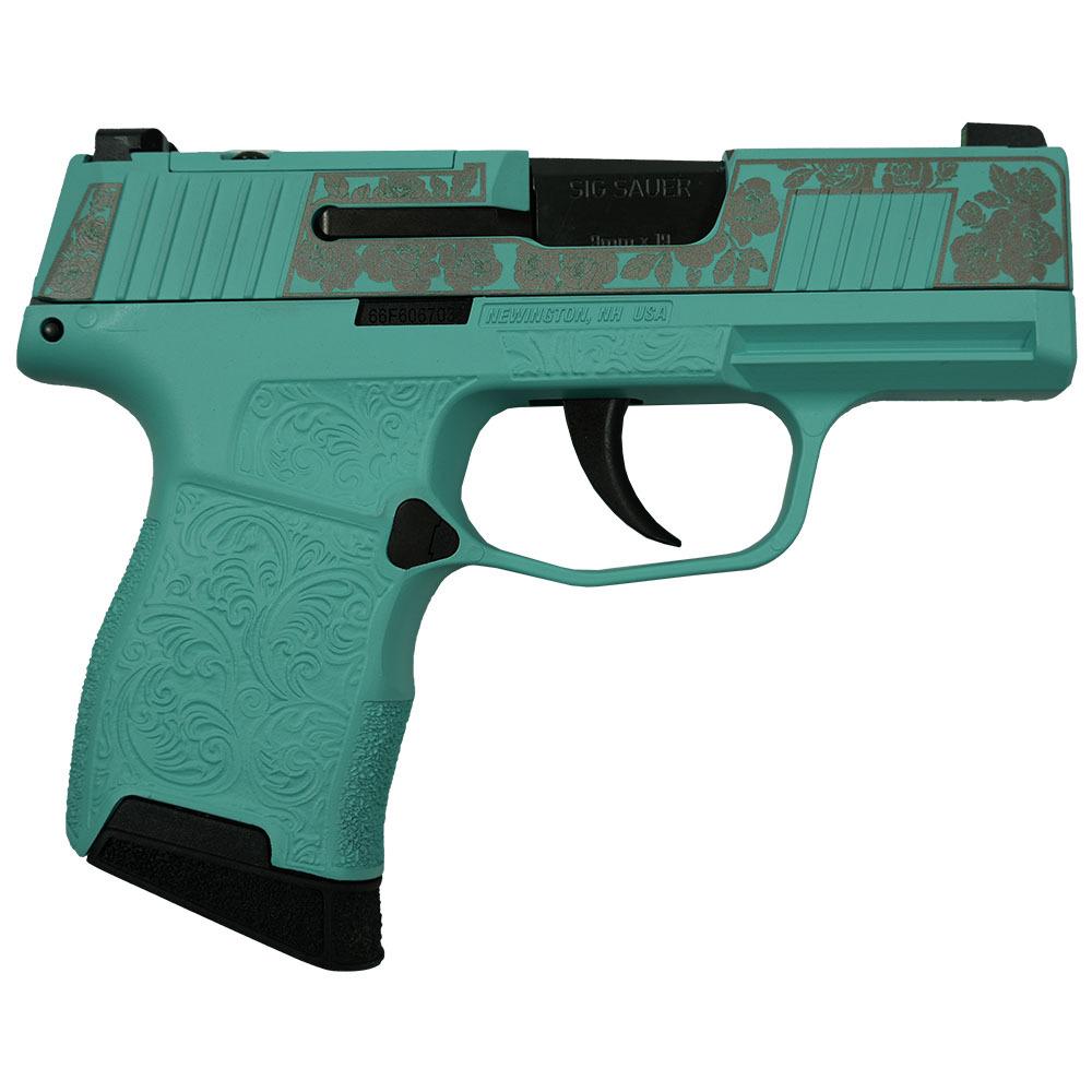 Turquoise handgun with floral design details.