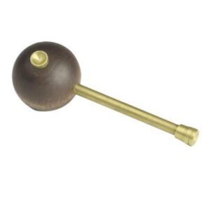 Wooden tool with brass handle for crafting.