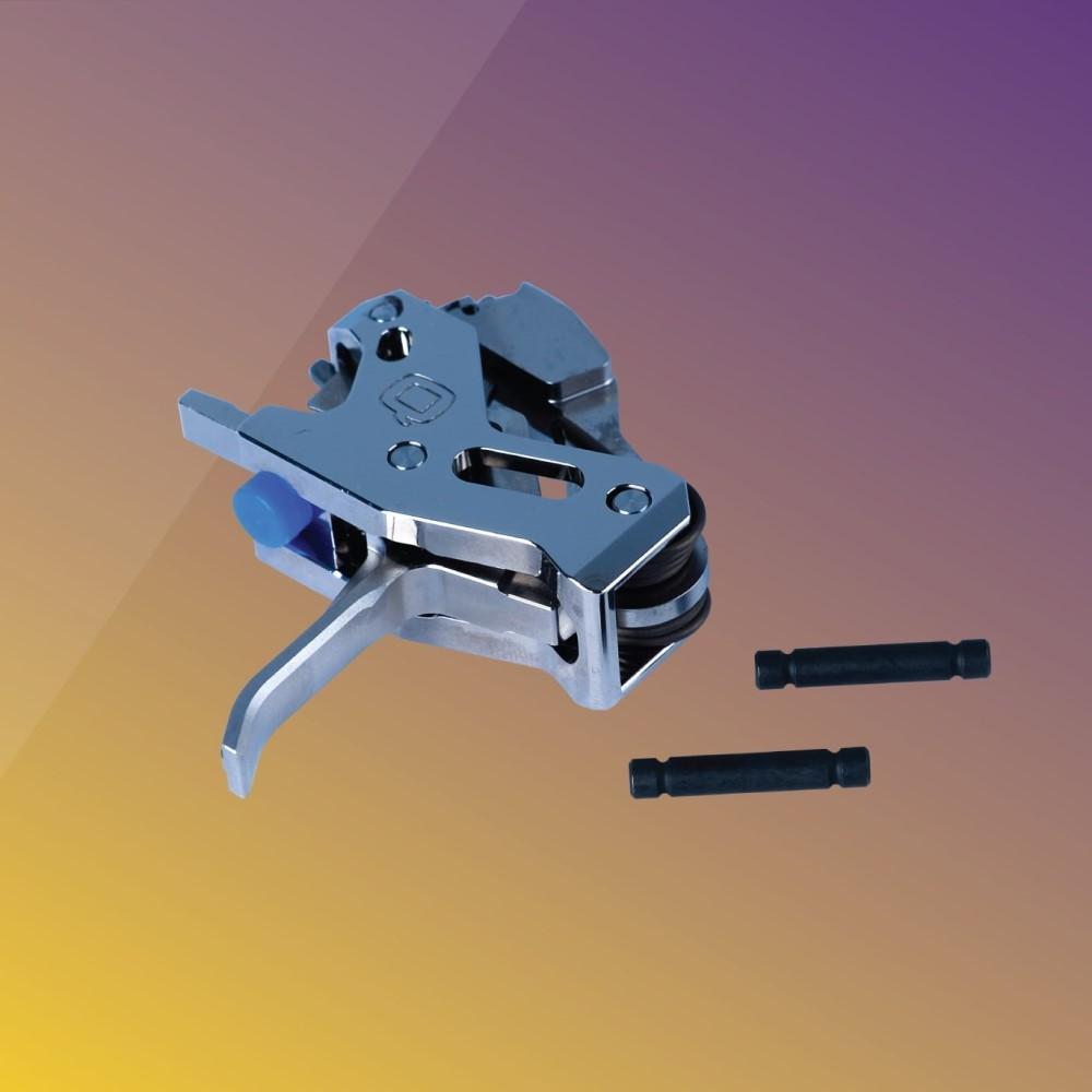 Close-up of a metallic trigger mechanism with pins.