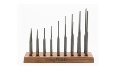 Set of precision metal tools on a stand.