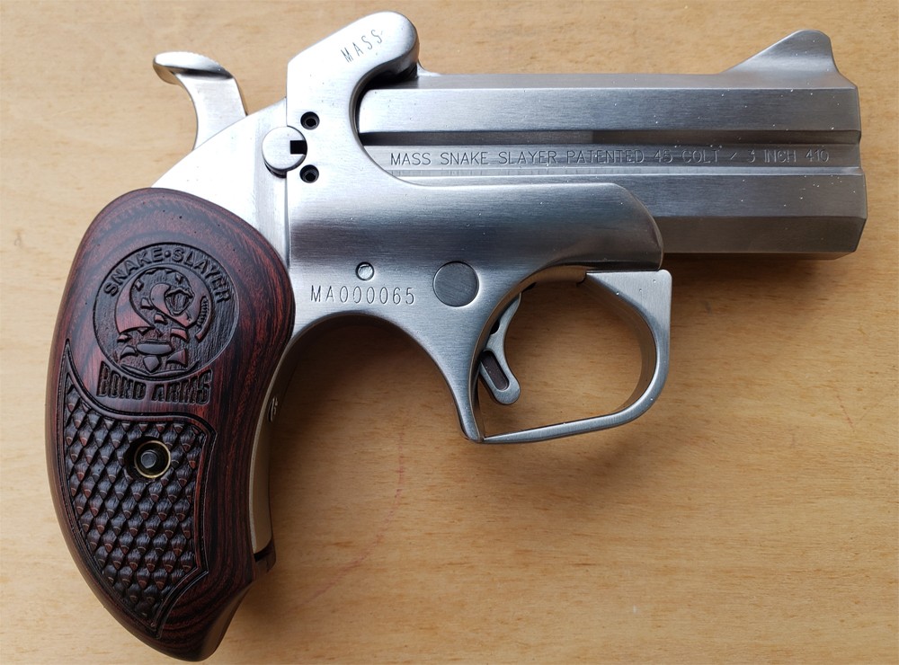 Stainless steel revolver with wooden grip.