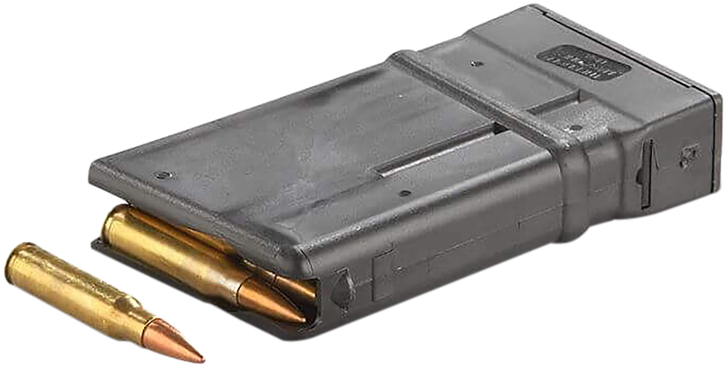 Rifle magazine with visible cartridges and loose bullet