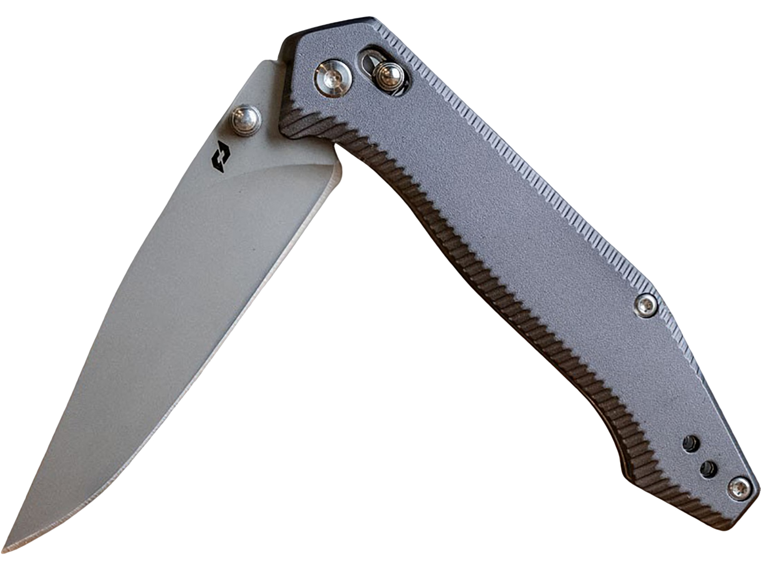 Open folding pocket knife on white background