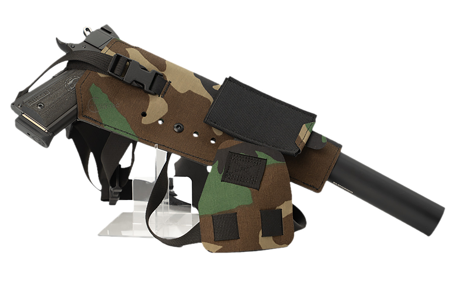 Handgun with suppressor in camouflage shoulder holster