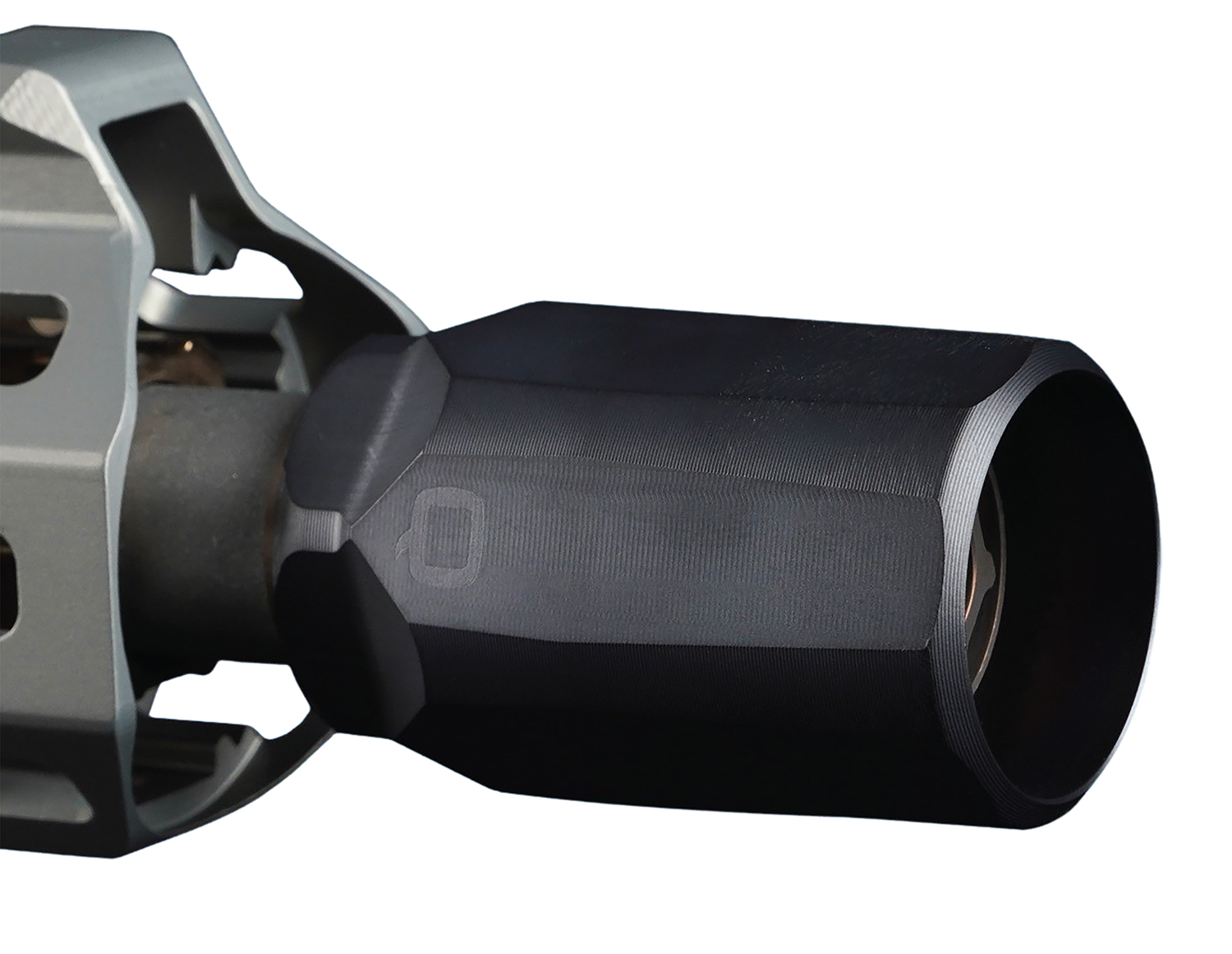 Close-up of rifle barrel with muzzle device