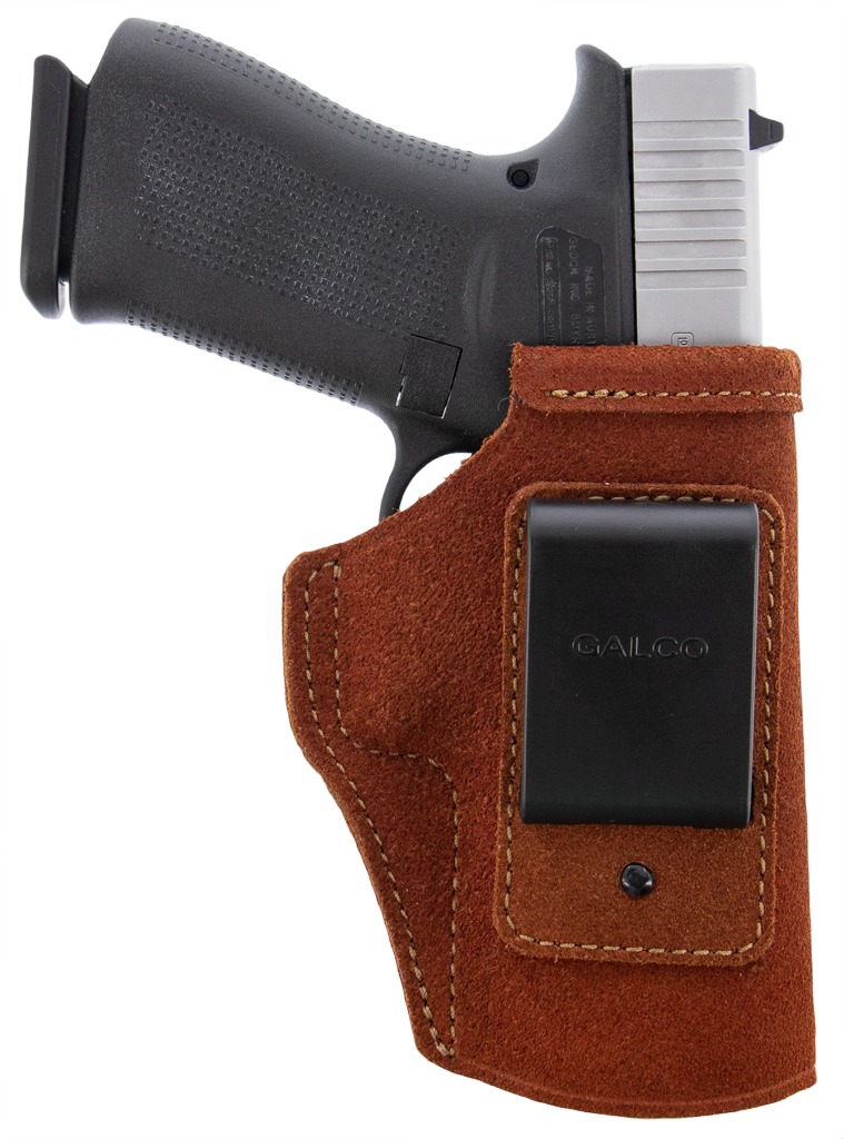 Handgun in brown leather belt holster