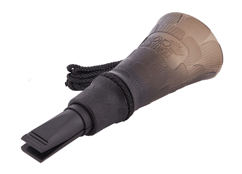 Brown and black duck call on white background