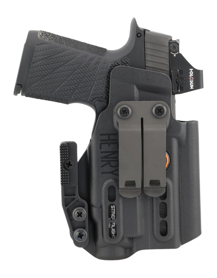 Handgun with optic sight in black holster