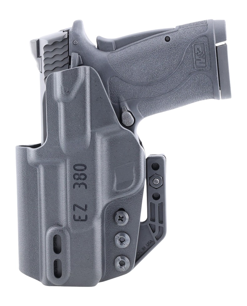 Handgun in gray polymer holster with belt clip