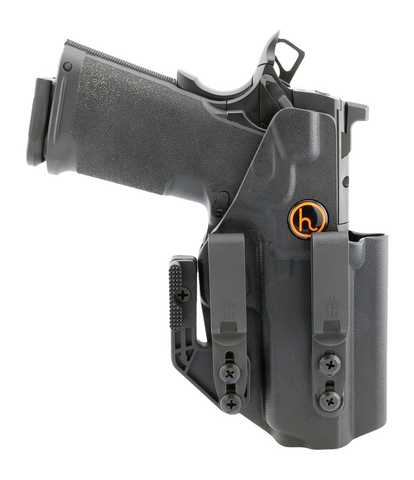 Black handgun in molded belt holster