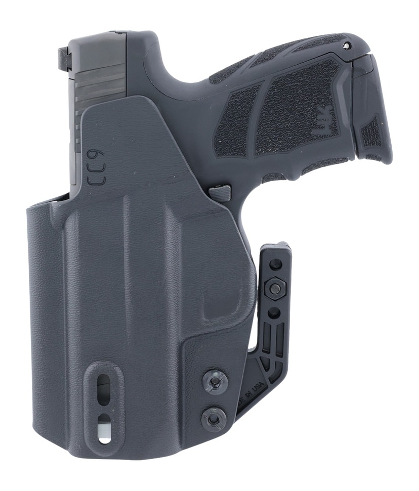Handgun in black concealed carry holster
