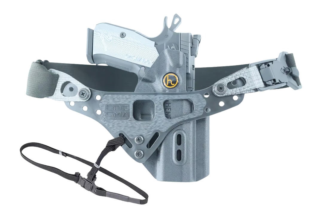 Handgun in tactical gray holster with belt strap