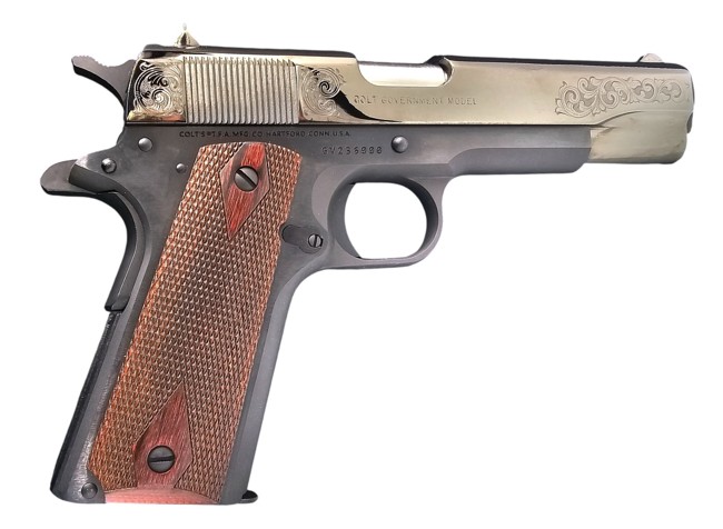 Engraved Colt 1911 pistol with wooden grip