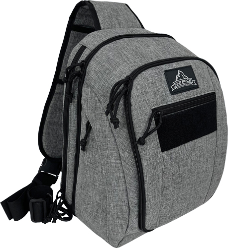 Gray sling backpack with black zippers and pocket