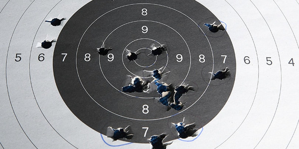Close-up of a shooting target with bullet holes