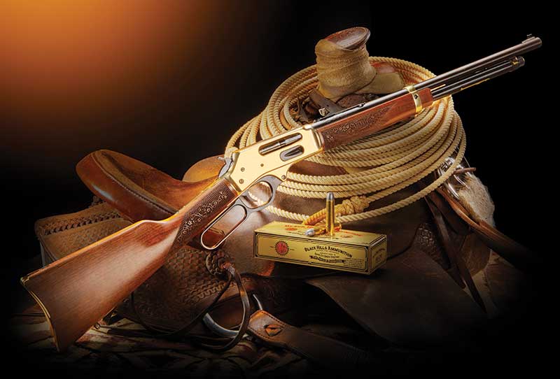 Lever-action rifle with cowboy gear and ammunition