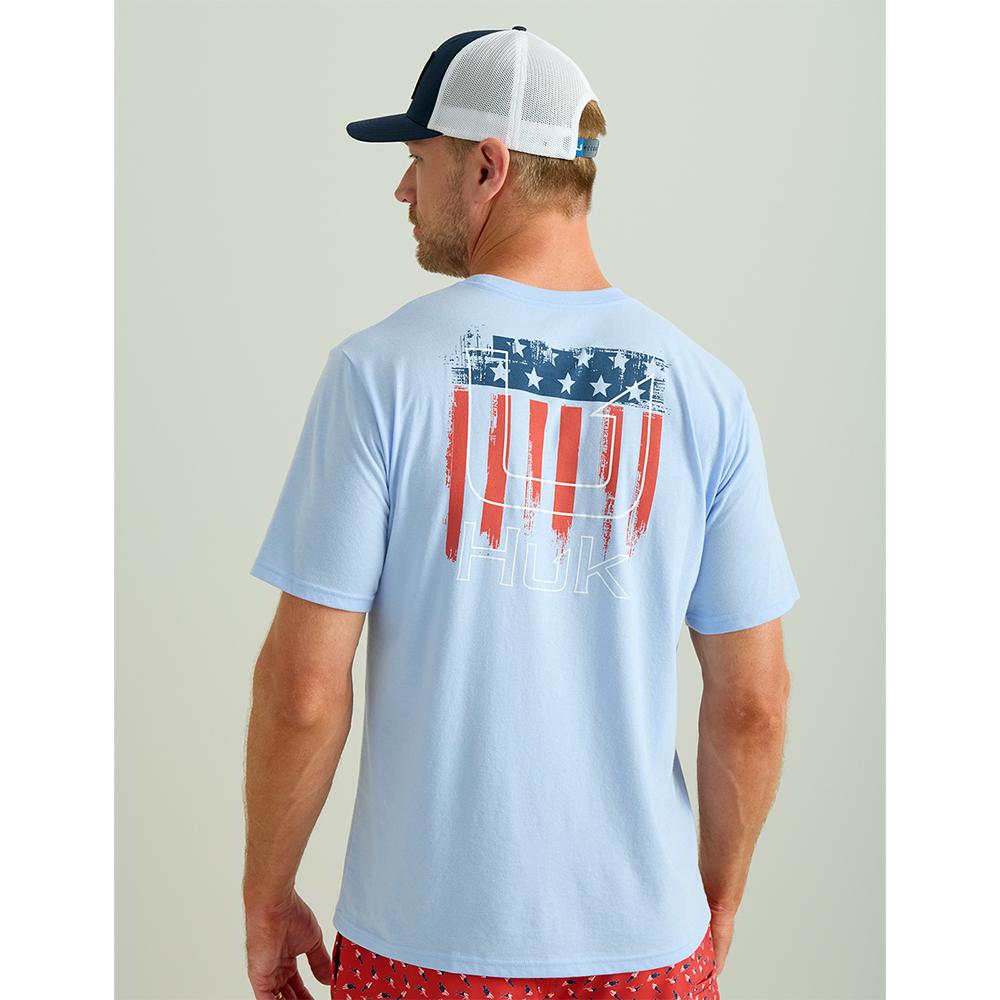 Man wearing light blue T-shirt with American flag