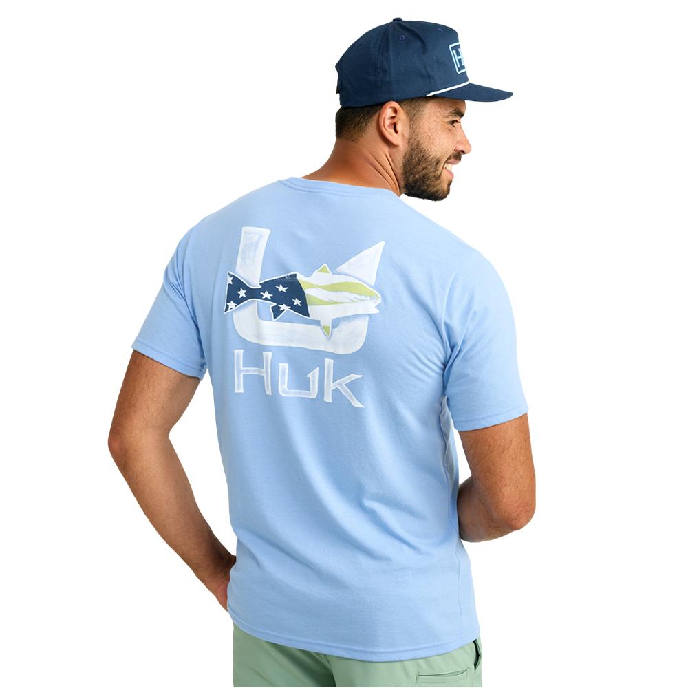 Man wearing light blue Huk fishing T-shirt