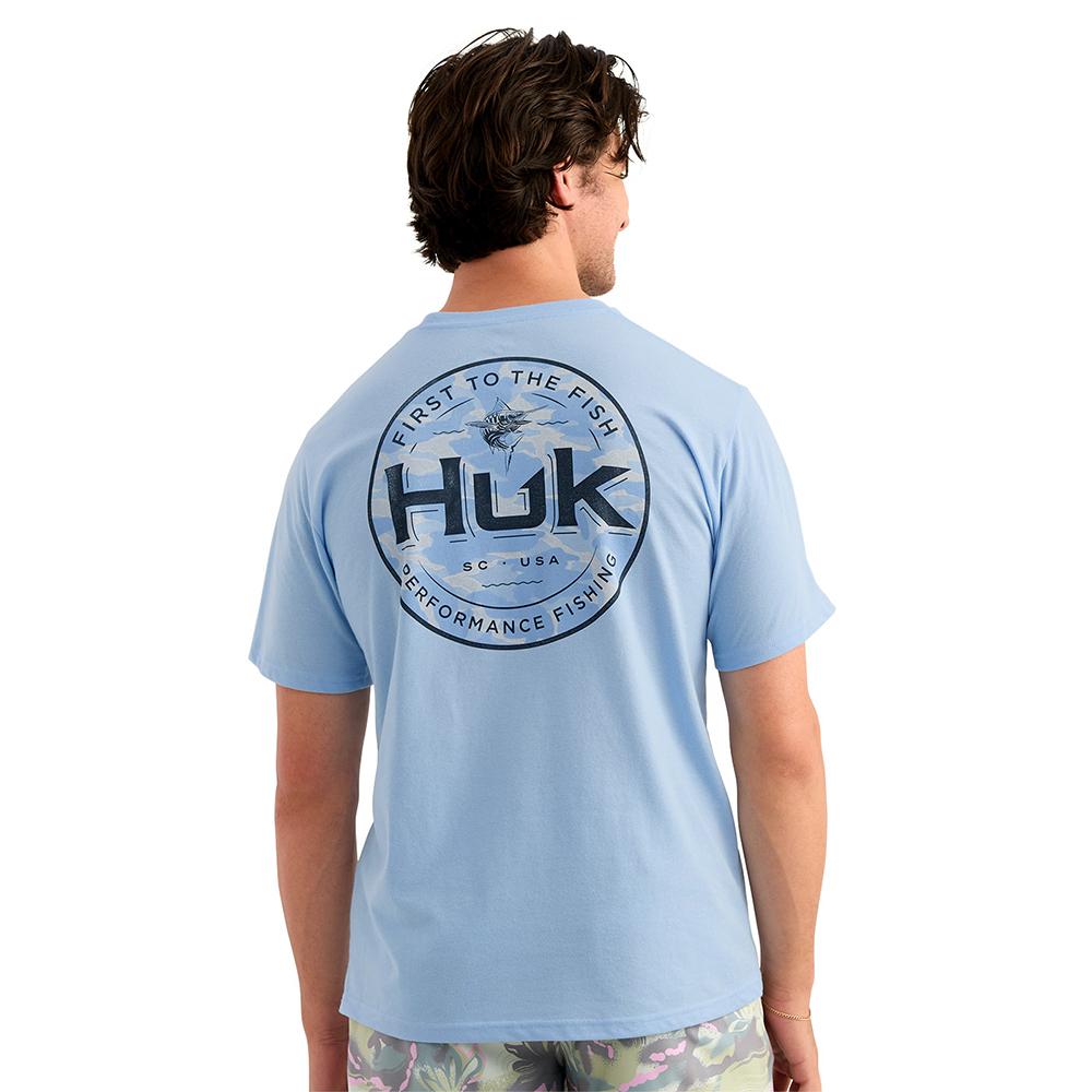 Man wearing light blue Huk fishing T-shirt