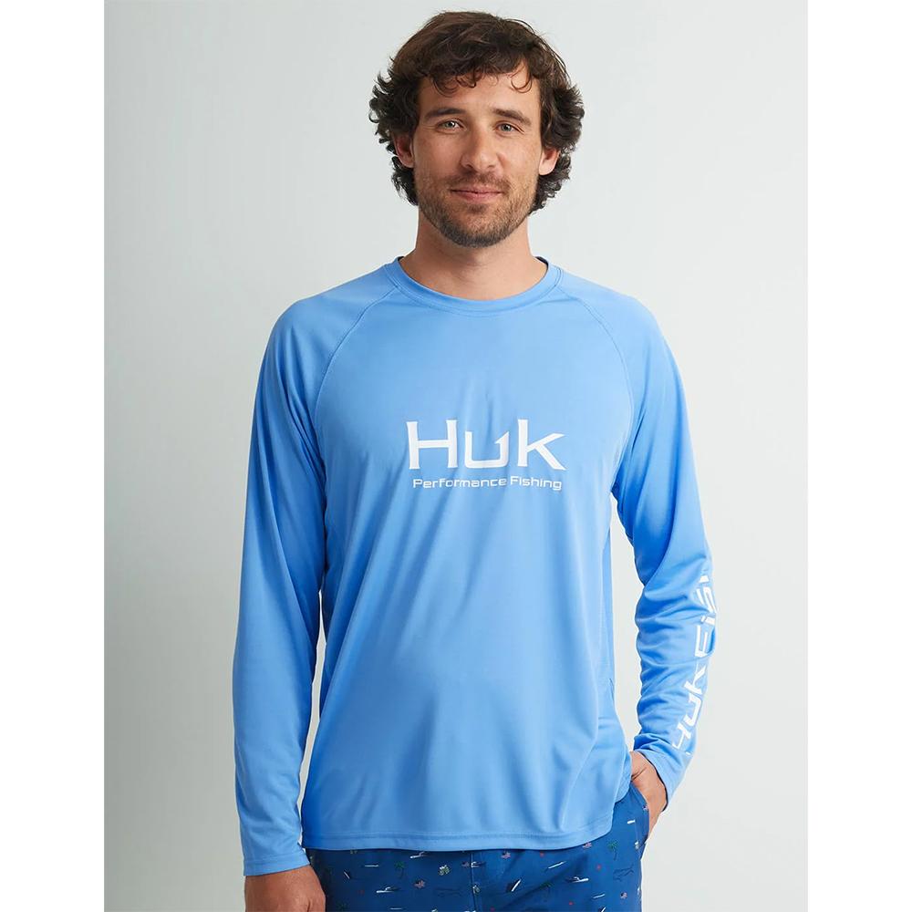 Man wearing blue Huk fishing shirt