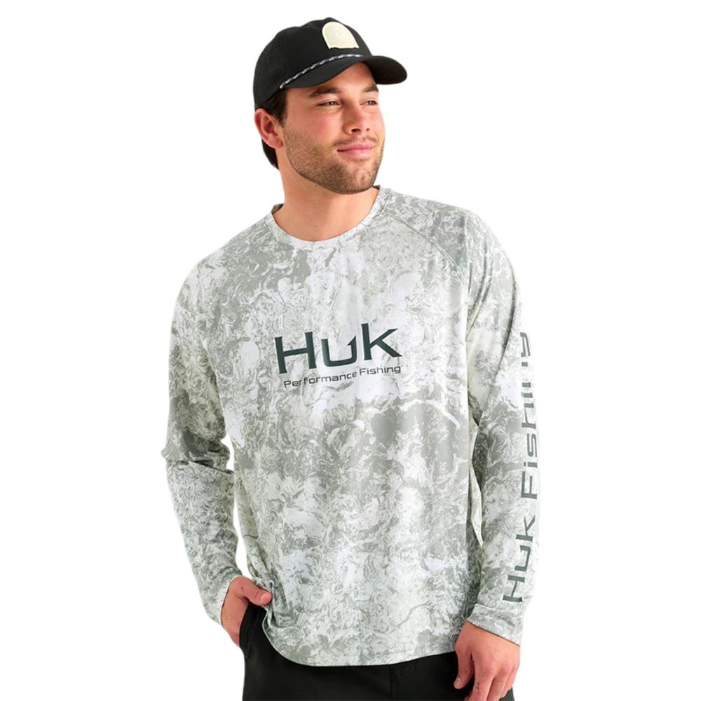 Man wearing Huk performance fishing long-sleeve shirt