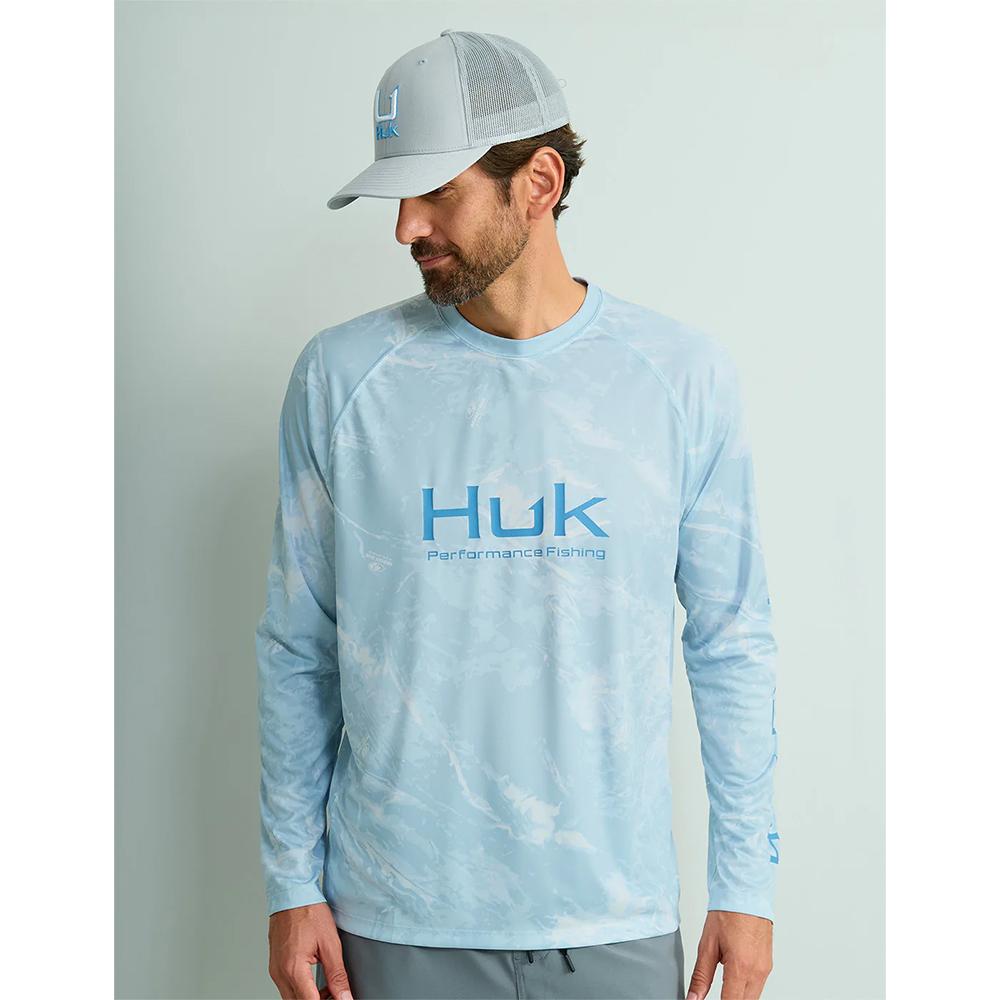 Man wearing light blue Huk fishing shirt