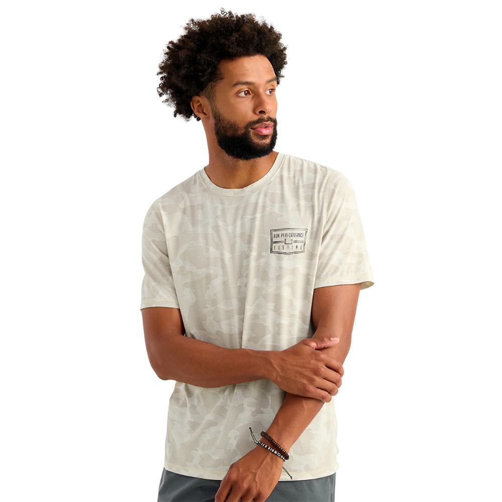 Man in light camo t-shirt looking sideways