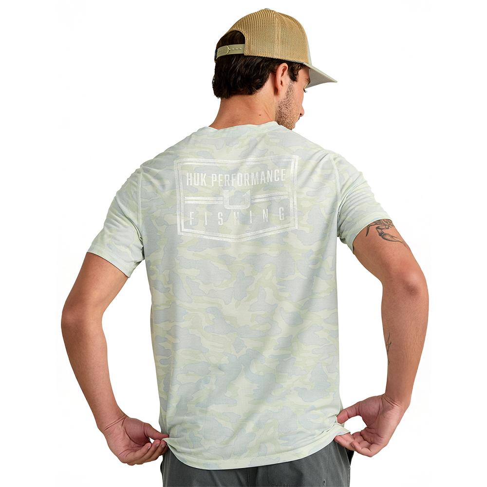 Man wearing camo Huk Performance Fishing t-shirt