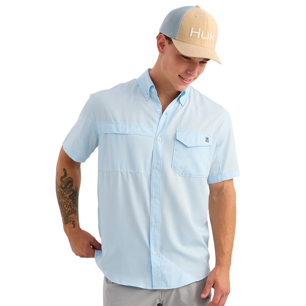 Man wearing light blue short-sleeve button-up shirt
