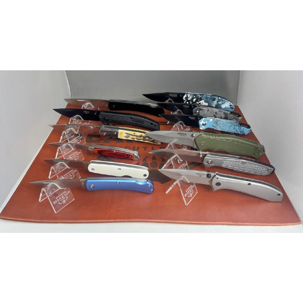 Collection of folding knives on display stands