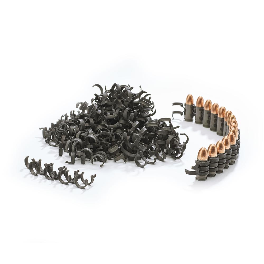 Metallic clips and bullets on a white background